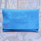 Handmade blue alcantara fabric pouch with artisanal red stitching made in paris